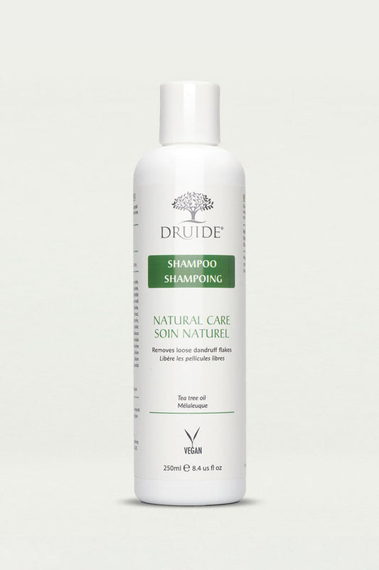 Druide Tea Tree Oil Shampoo for Dandruff 250 ml flip top white dispenser shown against a clear background.