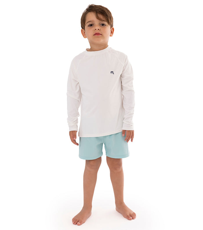 White boy wearing white rashguard dryfit with aqua blue shorts