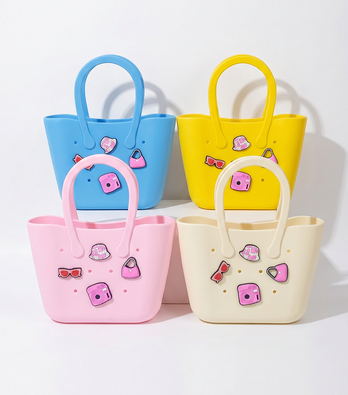 Four colorful handbags with decorative elements on a white background