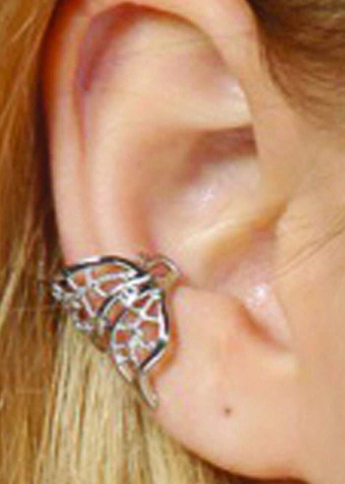 ear wearing silver filigree ear cuff with curved wing design