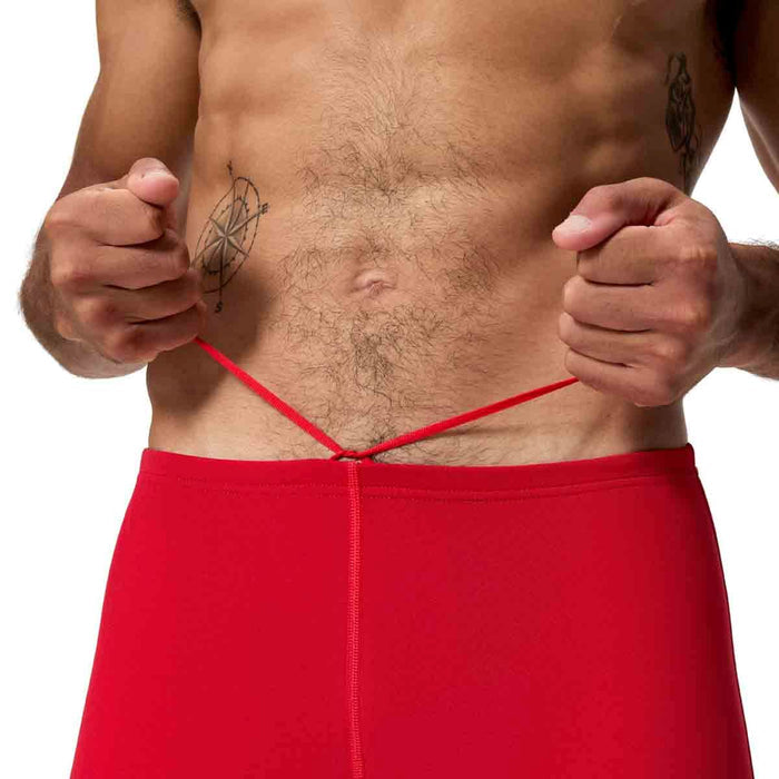 Speedo men's Endurance+ Logo Jammer in High Risk Red, showcasing a sleek swim jammer with Speedo branding and a vibrant red color.
