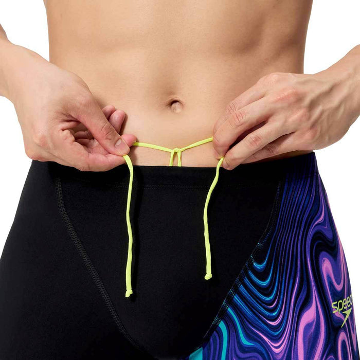 Speedo men's Fastskin LZR Ignite jammer in black and purple swimming suit, designed for competitive swimming.