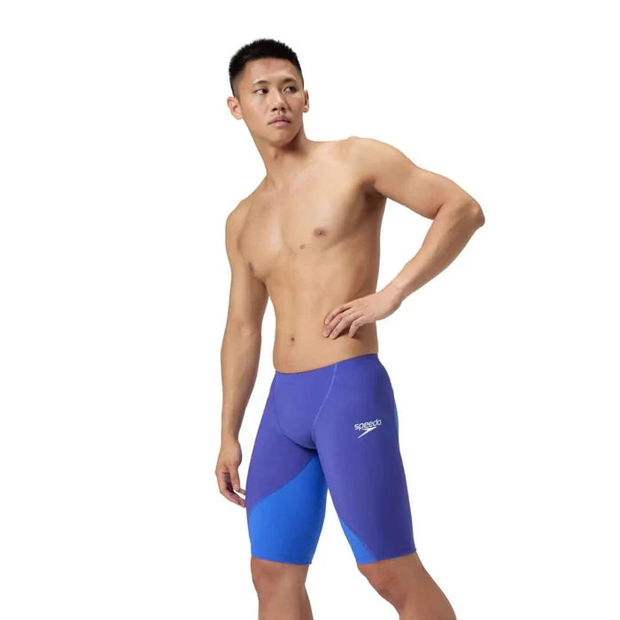 Speedo men's Fastskin LZR Ignite jammer in purple, close-up view showcasing the sleek swimwear design and branding.