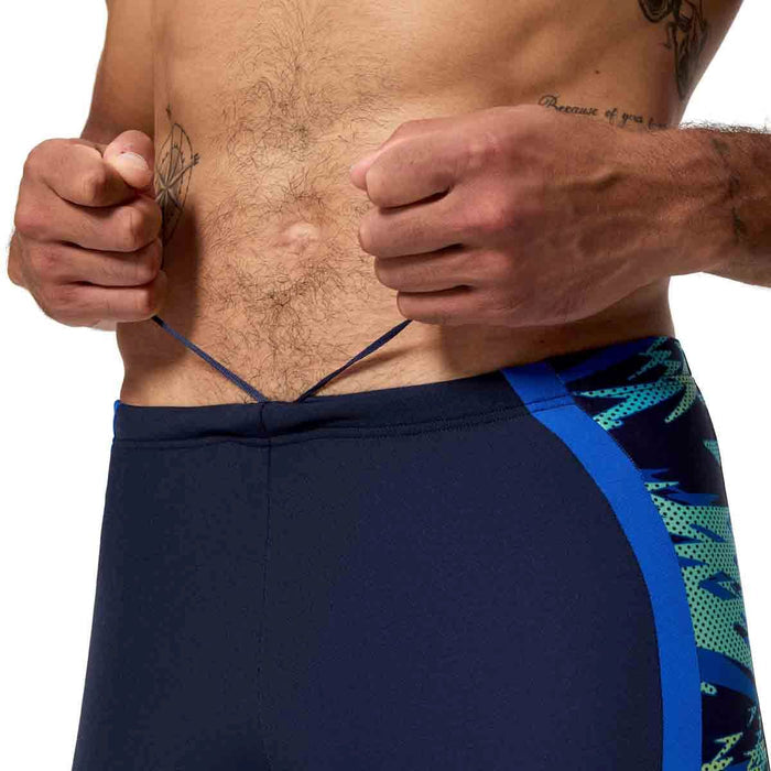 Speedo men's HyperBoom Splice jammer in peacoat and deep sapphire, featuring a sleek swimwear design with bold color accents.