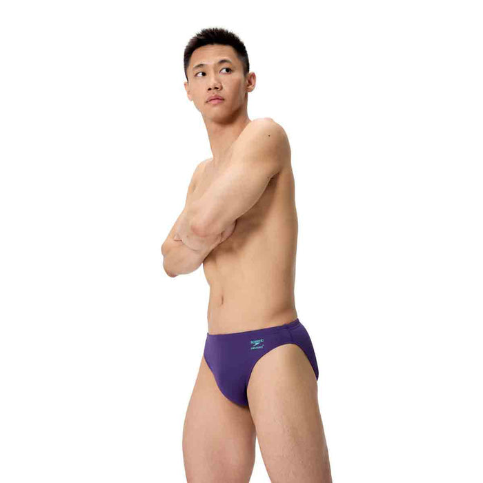 Speedo men's ML solid brief in acai purple, close-up of the snug-fitting swimwear with smooth fabric and elastic waistband.