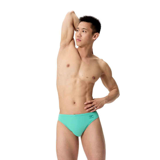 Speedo men's ML solid brief in Aqua Breeze, close-up view showing the snug fit and vibrant color of the swimwear.