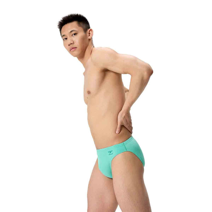 Speedo men's ML solid brief in Aqua Breeze, showing the swimwear with a snug fit and vibrant blue color, front view.