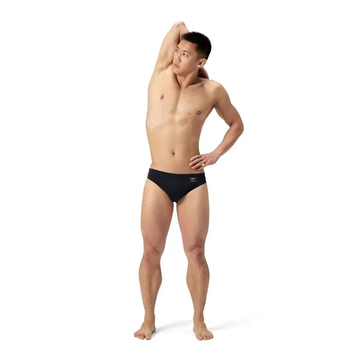 Speedo men's ML solid brief in black, showcasing a comfortable swimwear design with a snug fit for competitive swimming.