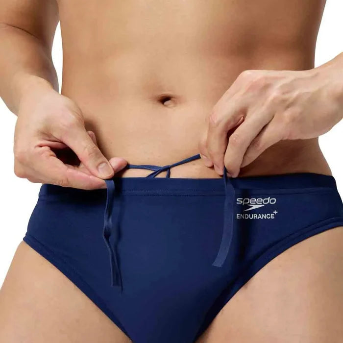 Speedo men's ML solid brief in team navy, close-up of fitted swimwear with Speedo logo on the front.