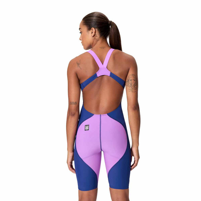 Speedo Women's Fastskin LZR Ignite kneeskin in navy and purple, close-up of fitted swim kneesuit fabric and design details.
