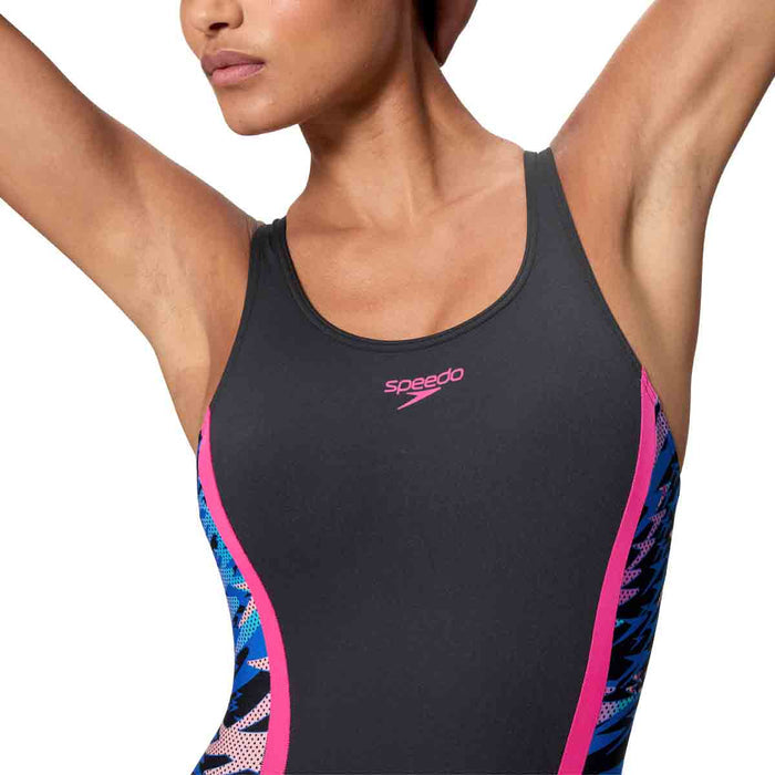 Speedo women's HyperBoom Splice muscleback legsuit in anthracite and margarita pink, shown on a model.