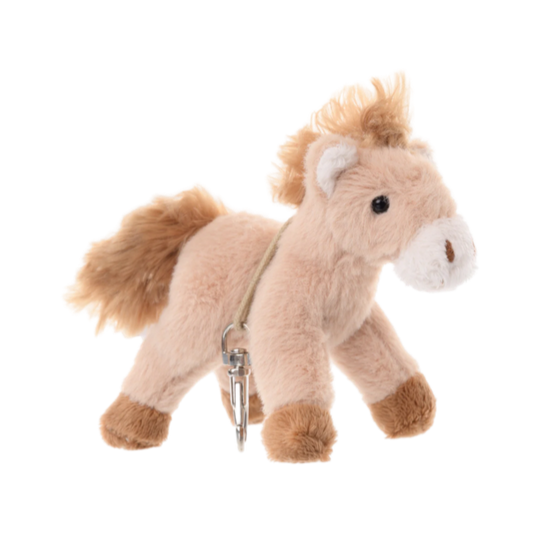 Say hello to Sugar — the sweetest little pony in the Bukowski bunch. This 4-inch plush charm is made in Sweden with a soft cream coat and irresistible fuzzy texture. Clip her onto your bag, keys, or backpack for a touch of playful spirit and equestrian flair wherever you go.