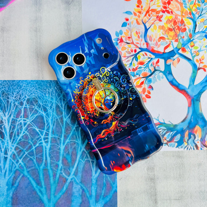 The Wishing Tree mystical fantasy MagSafe phone grip ring with vibrant orange and blue swirling filigree branches on a dark background compatible with iPhone and Samsung