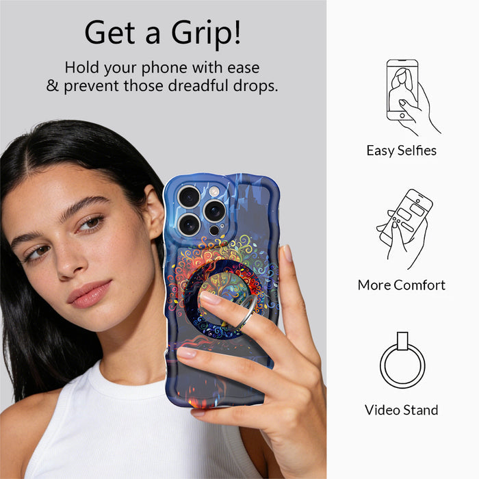 The Wishing Tree mystical fantasy MagSafe phone grip ring with vibrant orange and blue swirling filigree branches on a dark background compatible with iPhone and Samsung