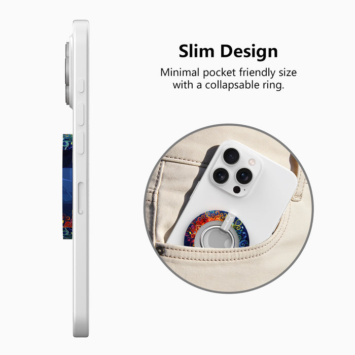 The Wishing Tree mystical fantasy MagSafe phone grip ring with vibrant orange and blue swirling filigree branches on a dark background compatible with iPhone and Samsung