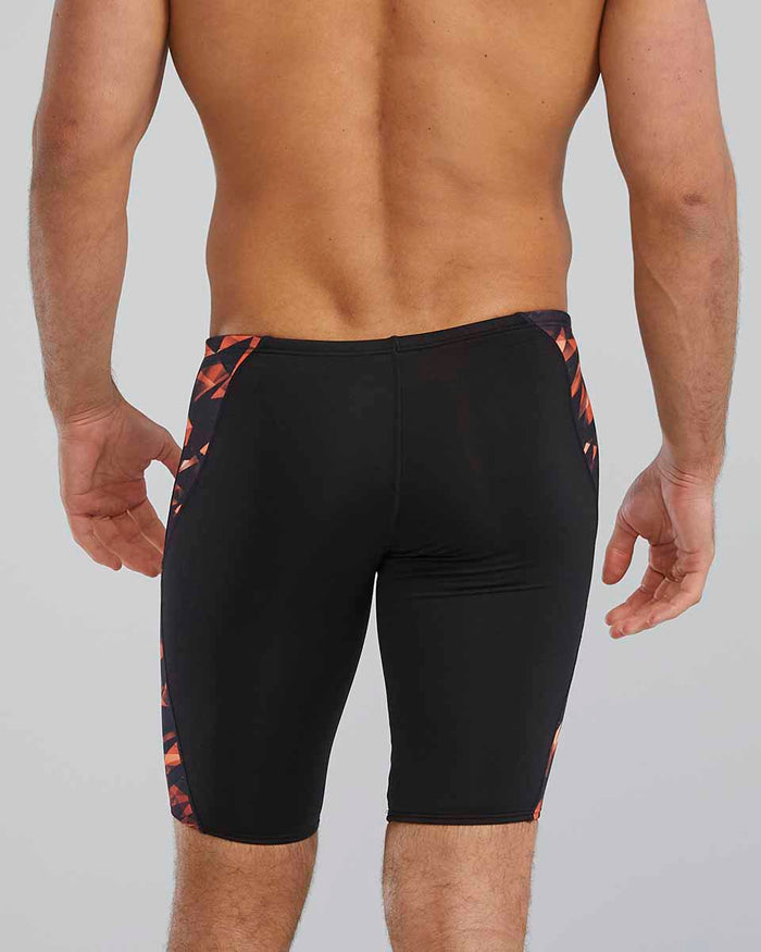 TYR men's Triadic Blade Splice jammer in orange, showcasing a snug fit and vibrant design for competitive swimming.
