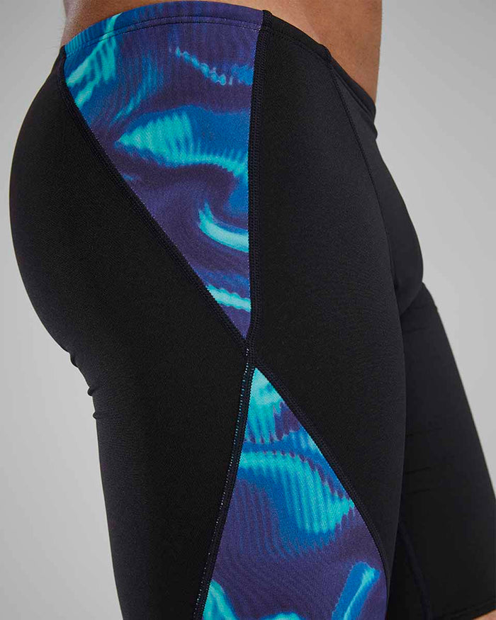 TYR men's Waveform Blade Splice jammer in blue and green featuring a sleek swimwear design, close-up of the fabric and pattern.