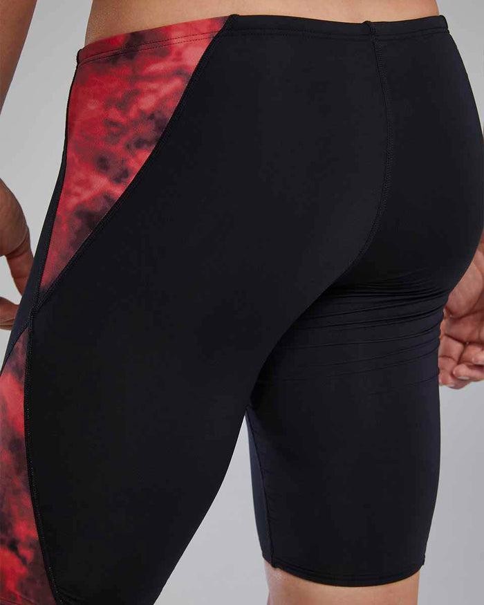 Red TYR men's Waveform Blade Splice jammers, close-up showing the sleek swimwear design and fabric details.