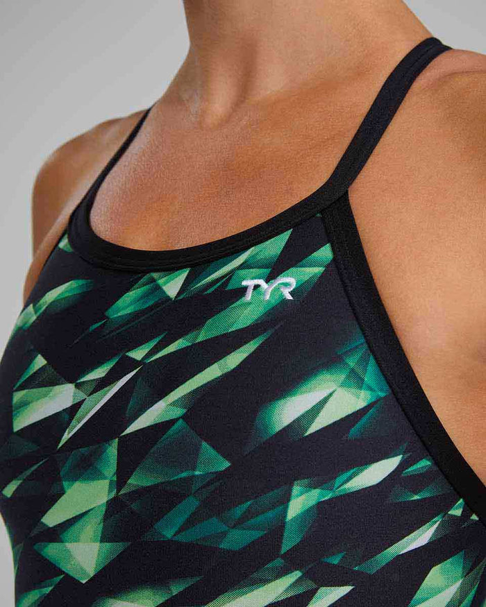 Green TYR Women's Triadic Diamondfit swimsuit displayed on a model, highlighting its sleek design and athletic fit.