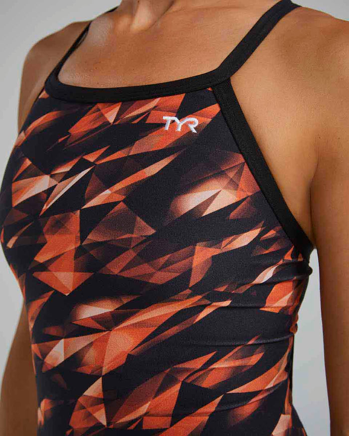 Orange TYR Women's Triadic Diamondfit swimsuit, close-up view showing the sleek design and comfortable fit.