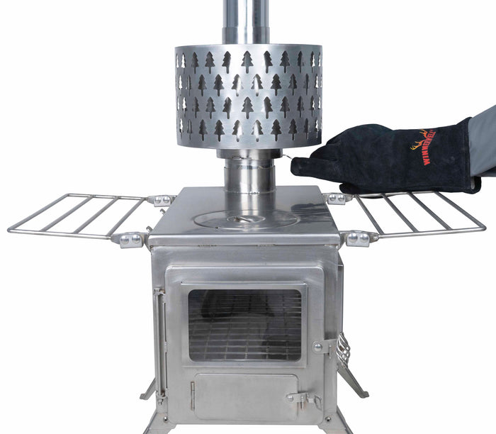 Front view of Winnerwell® Secondary Combustion Burner 3.5" attached to a stove, illustrating the complete setup and its function in enhancing stove efficiency.