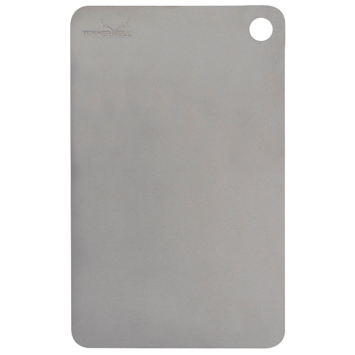 Winnerwell® titanium cutting board with a hanging hole, showcasing its sleek, flat, rectangular shape and metallic finish.