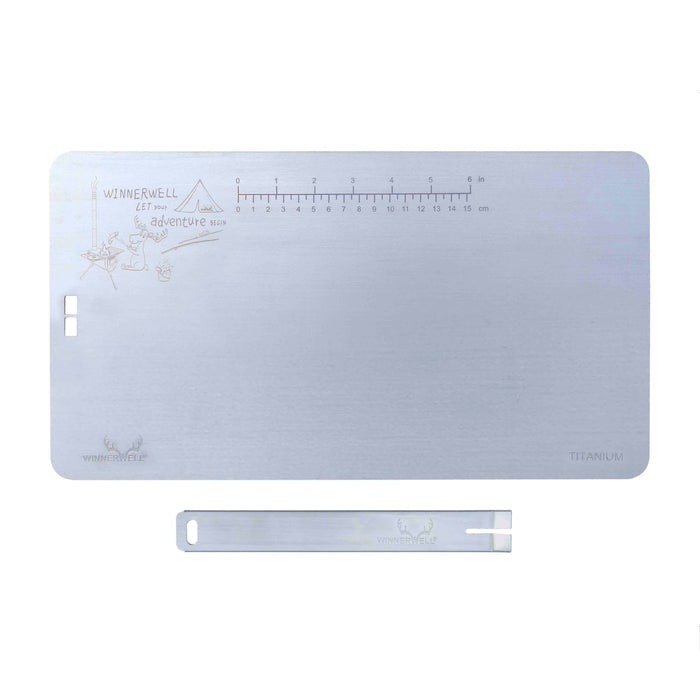 Winnerwell® titanium cutting board with handle displayed on a gray background, showcasing its flat, rectangular shape and integrated handle design.