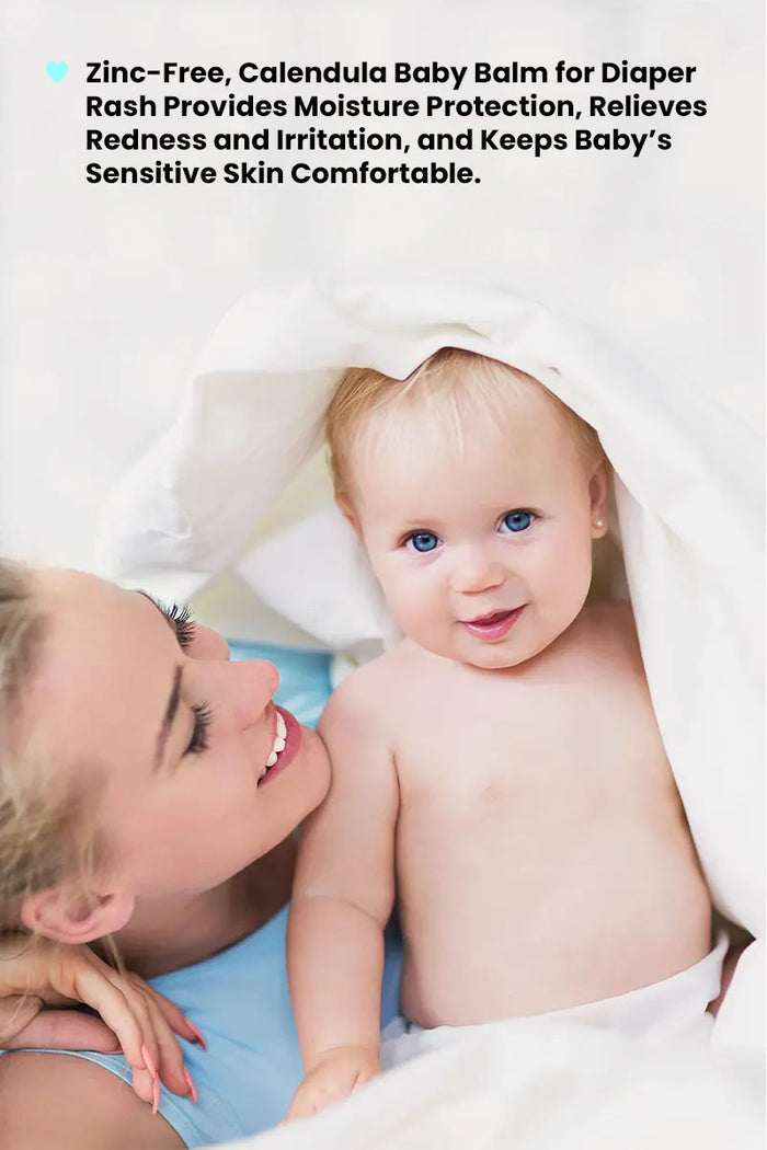 smiling mum looking at happy content baby with text reading "zinc free, calendula baby balm for diaper rash provides moisture protection, relieves redness and irritation and keeps baby's sensitive skin comfortable".